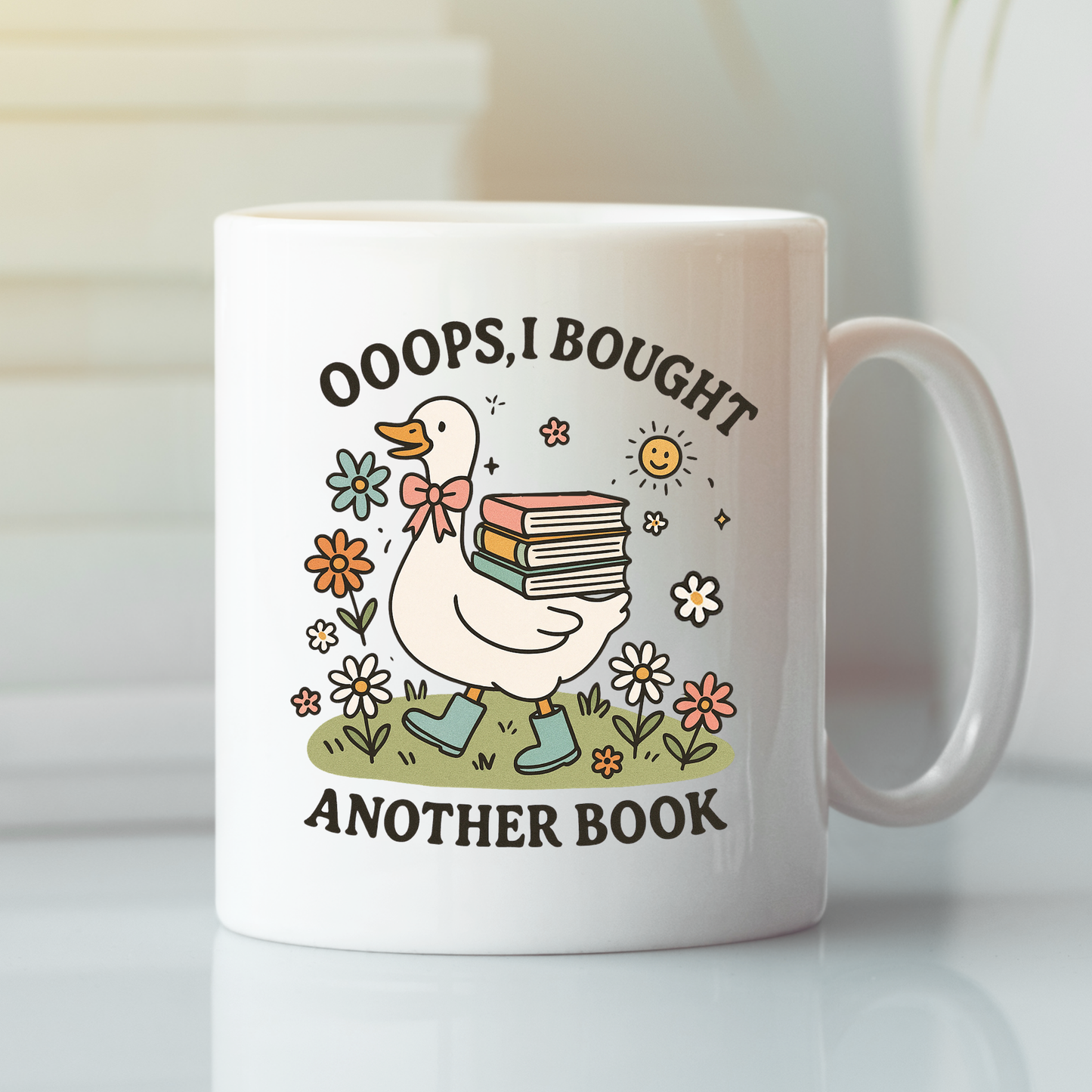 The Book Lover Mug | Ooops, I Bought Another Book Goose is a white cottagecore mug featuring a goose in boots with books, flowers, and sunshine—an ideal gift for book lovers.