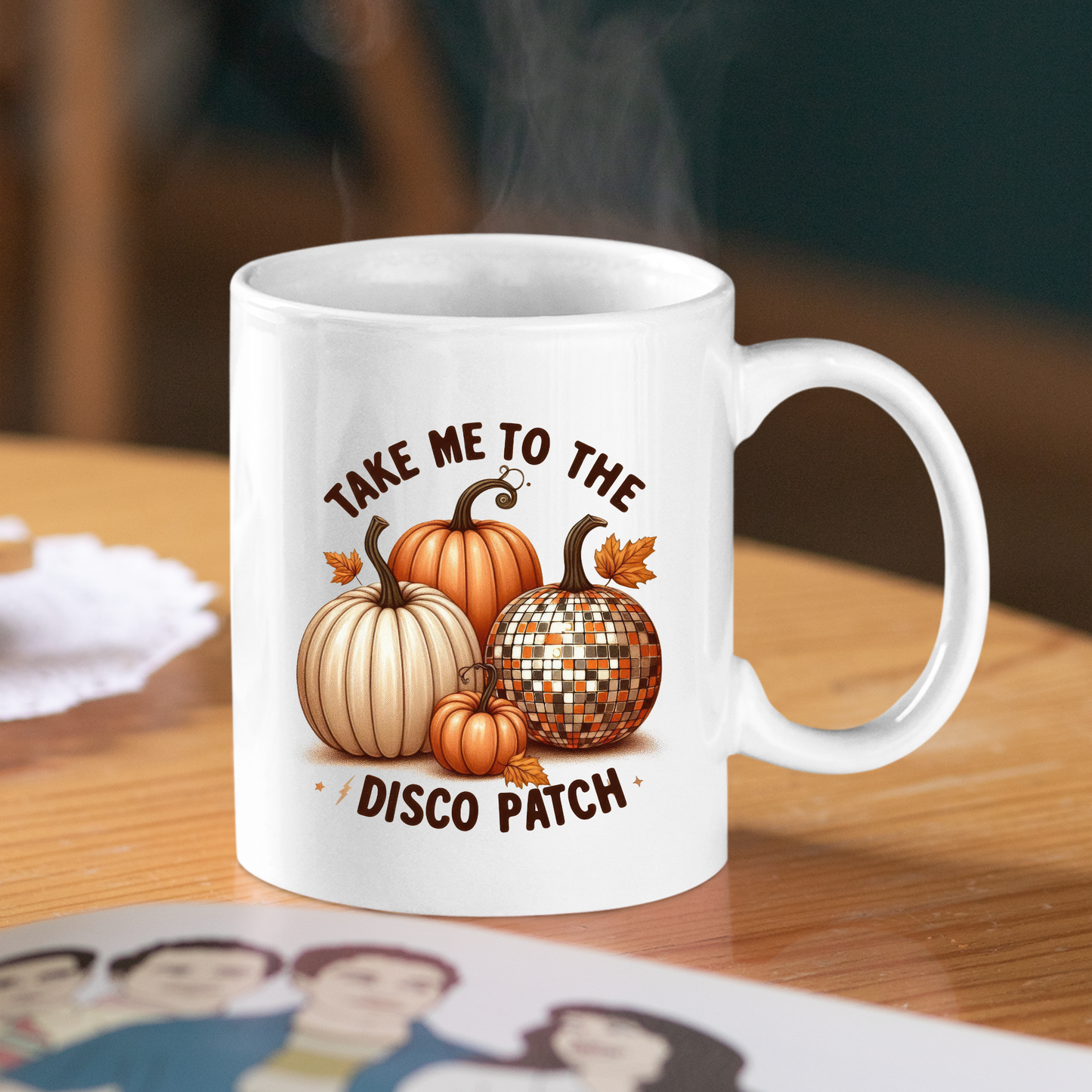 The Take Me to the Disco Patch Mug | Funny Fall Pumpkin Gift features three pumpkins and "Take Me to the Disco Patch"—perfect as a retro fall coffee mug for autumn vibes. Steam rises as it sits on a wooden table, ideal for seasonal drinks.