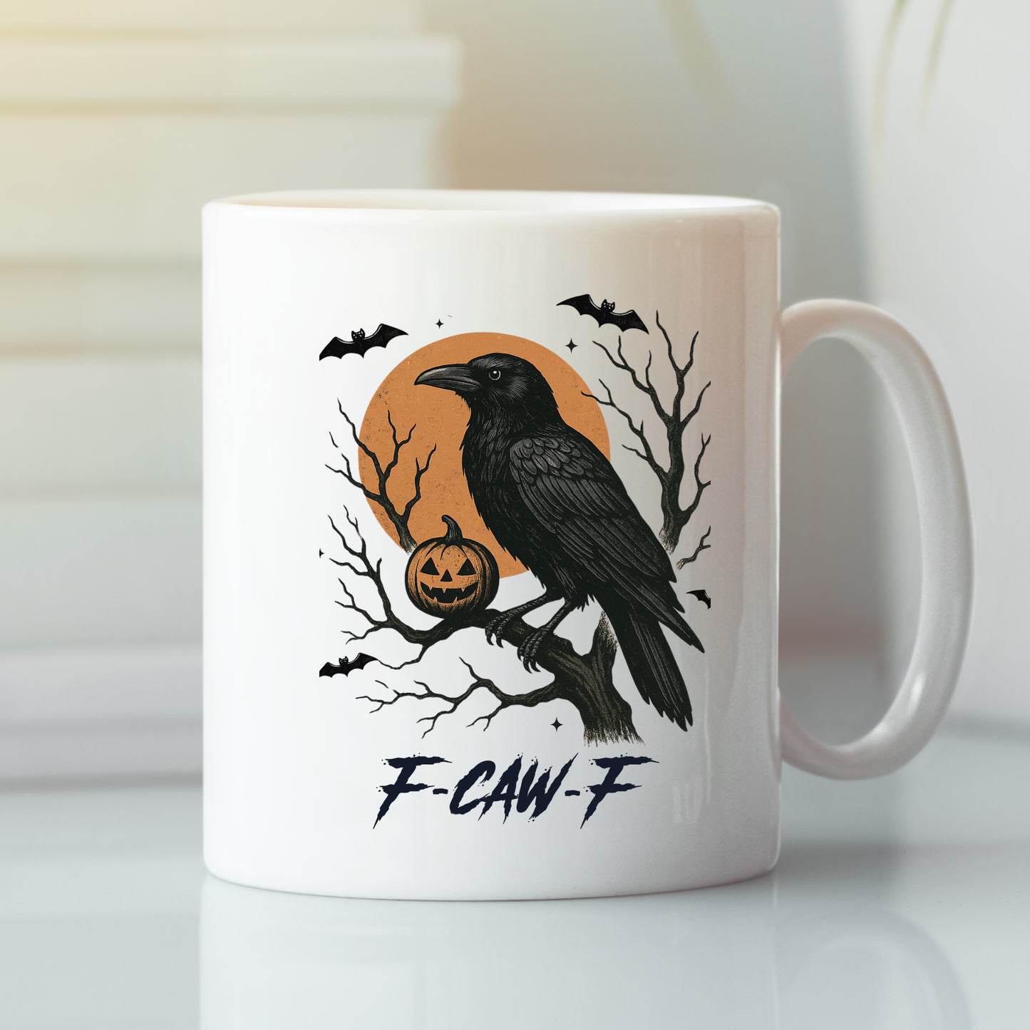 The F-CAW-F Raven Mug | Gothic Halloween Coffee Cup is a white mug with a raven on a branch, carved pumpkin, bats, leafless trees, and an orange moon. “F-CAW-F” appears beneath the Gothic illustration.