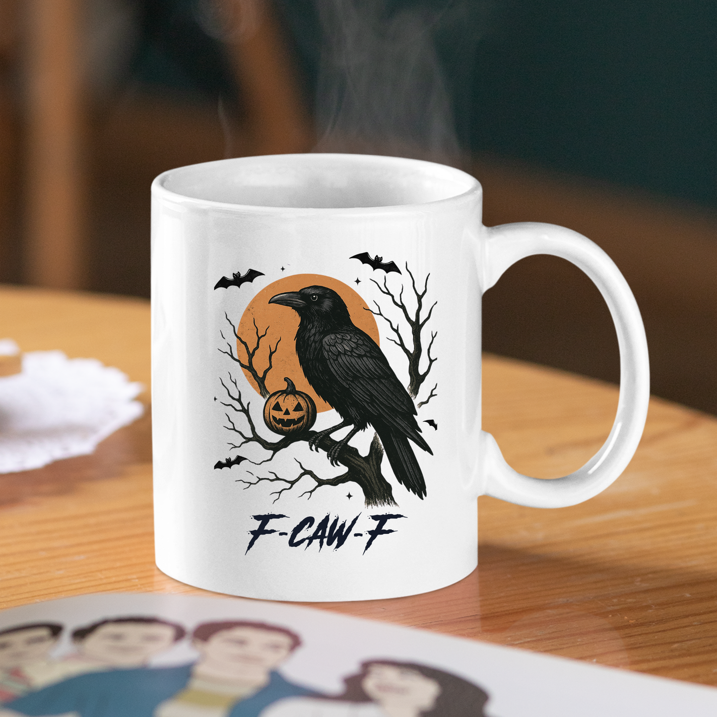 The F-CAW-F Raven Mug | Gothic Halloween Coffee Cup features a black crow on a branch with a jack-o’-lantern, bats, and an orange moon. "F-CAW-F" is printed below the design—perfect for any gothic mug collection.