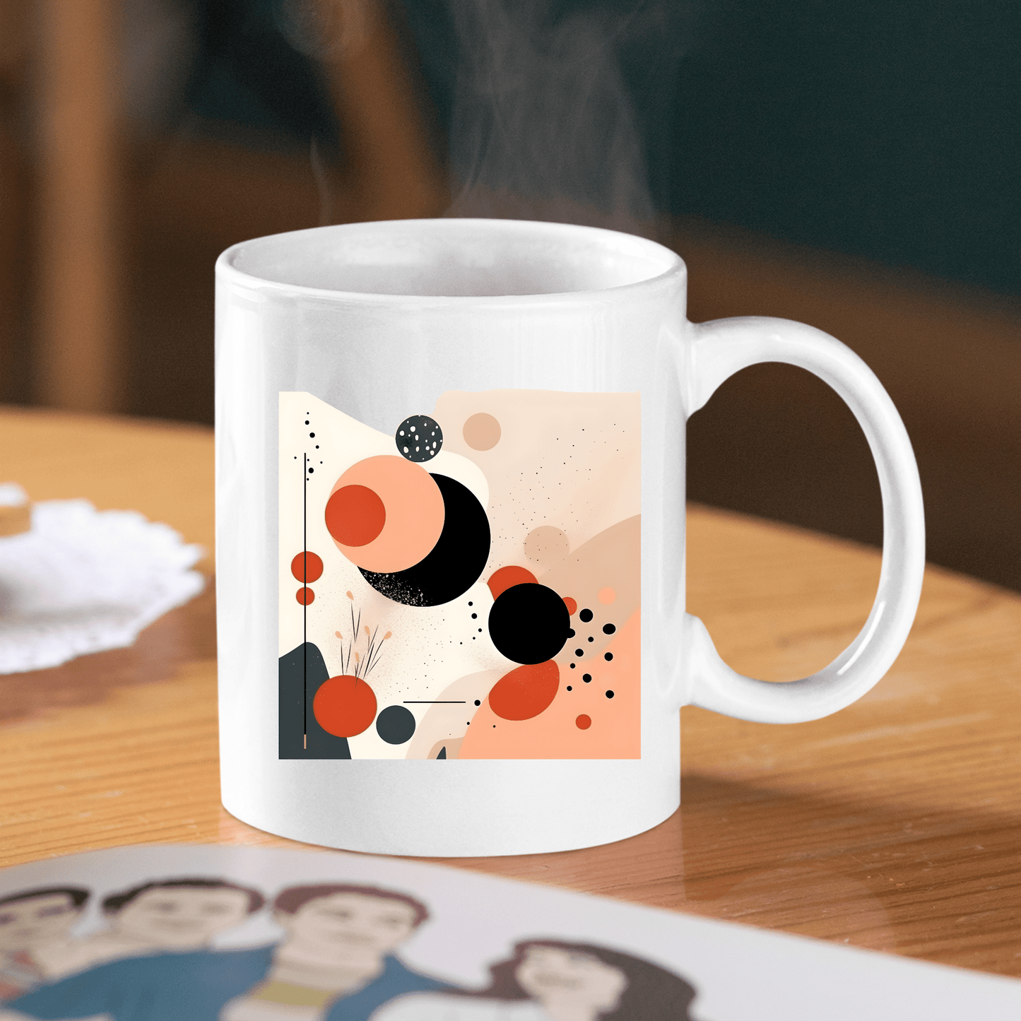 The Solar Bloom Mid Century Modern Mug, in white, rests on a wooden table and displays black, orange, and beige abstract geometric shapes and dots. Steam rises from the mug as a blurred photo and doily sit in the foreground.