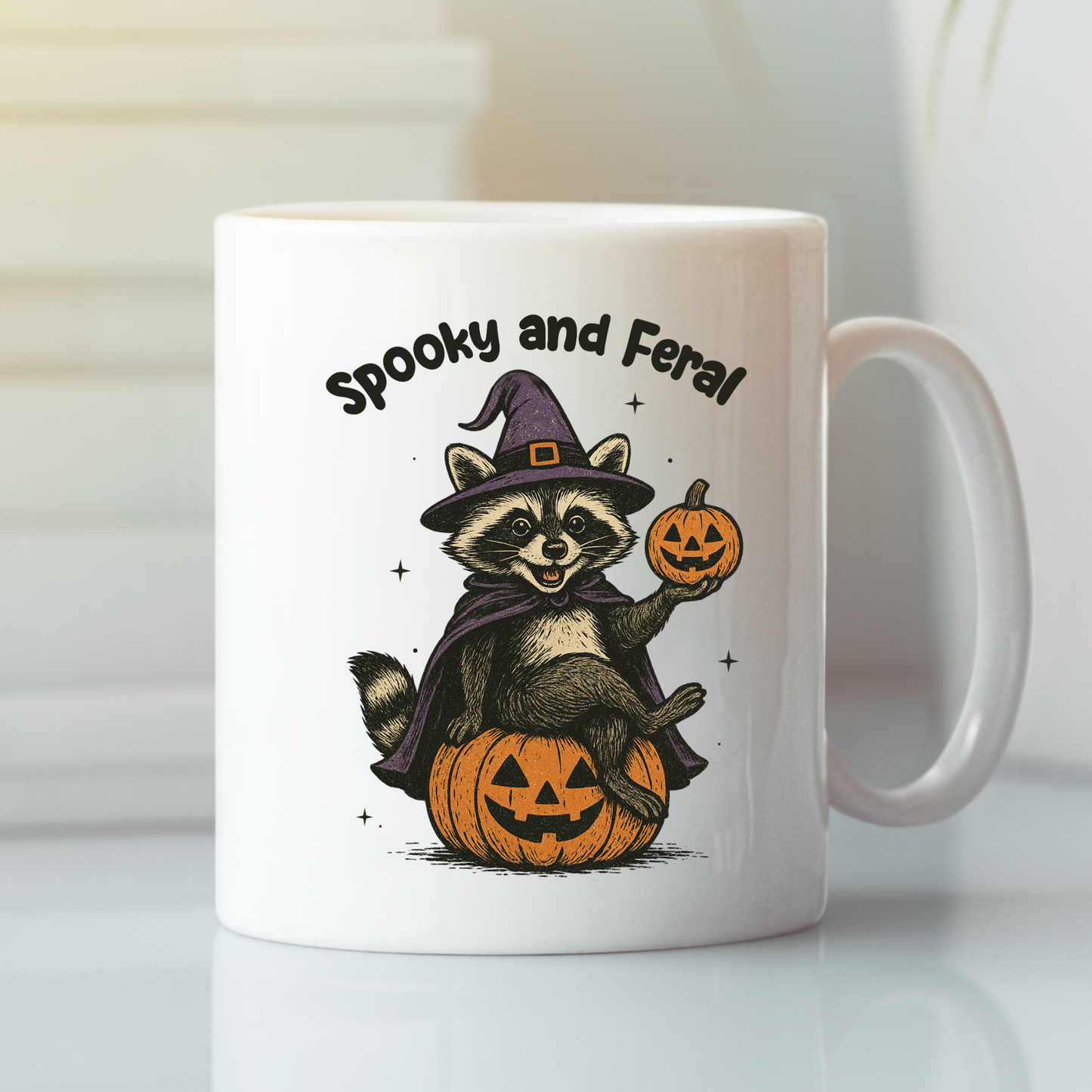 Celebrate spooky season with the Spooky and Feral Raccoon Mug! Featuring a cartoon raccoon in a witch hat on a jack-o'-lantern with "Spooky and Feral" text. A perfect funny Halloween gift for any raccoon mug collection.