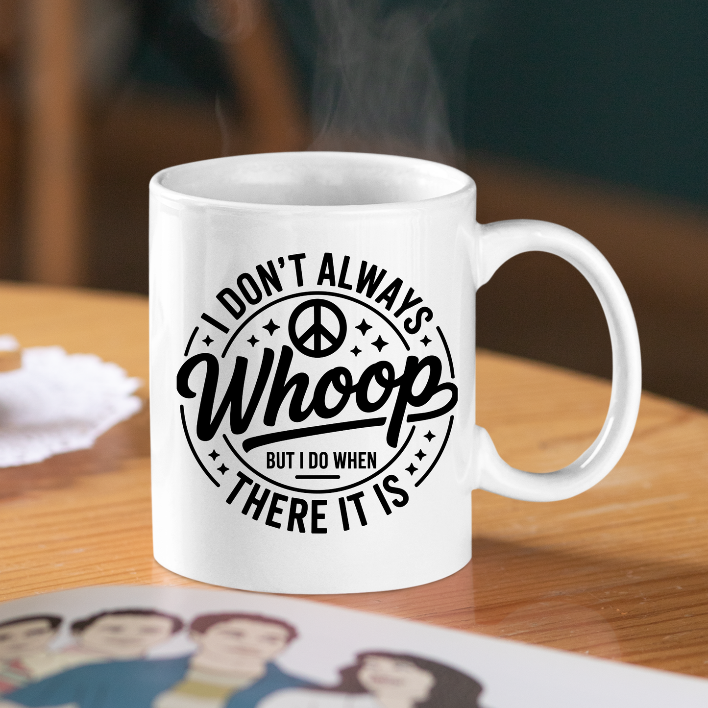 A white "I Don't Always Whoop There It Is Mug | Sarcastic Chaos Coffee Cup" sits on a wooden table, displaying the phrase “I don’t always whoop, but I do when there it is” alongside a peace symbol. Steam rises from this sarcastic mug, making it the perfect funny coffee cup for anyone who loves humor in their daily routine.