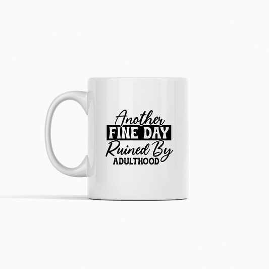 The Another Fine Day Mug – Funny Adulthood Coffee Cup features black text saying "Another fine day ruined by adulthood" on white, making it a perfect sarcastic gift for anyone who loves adult humor with their morning coffee.