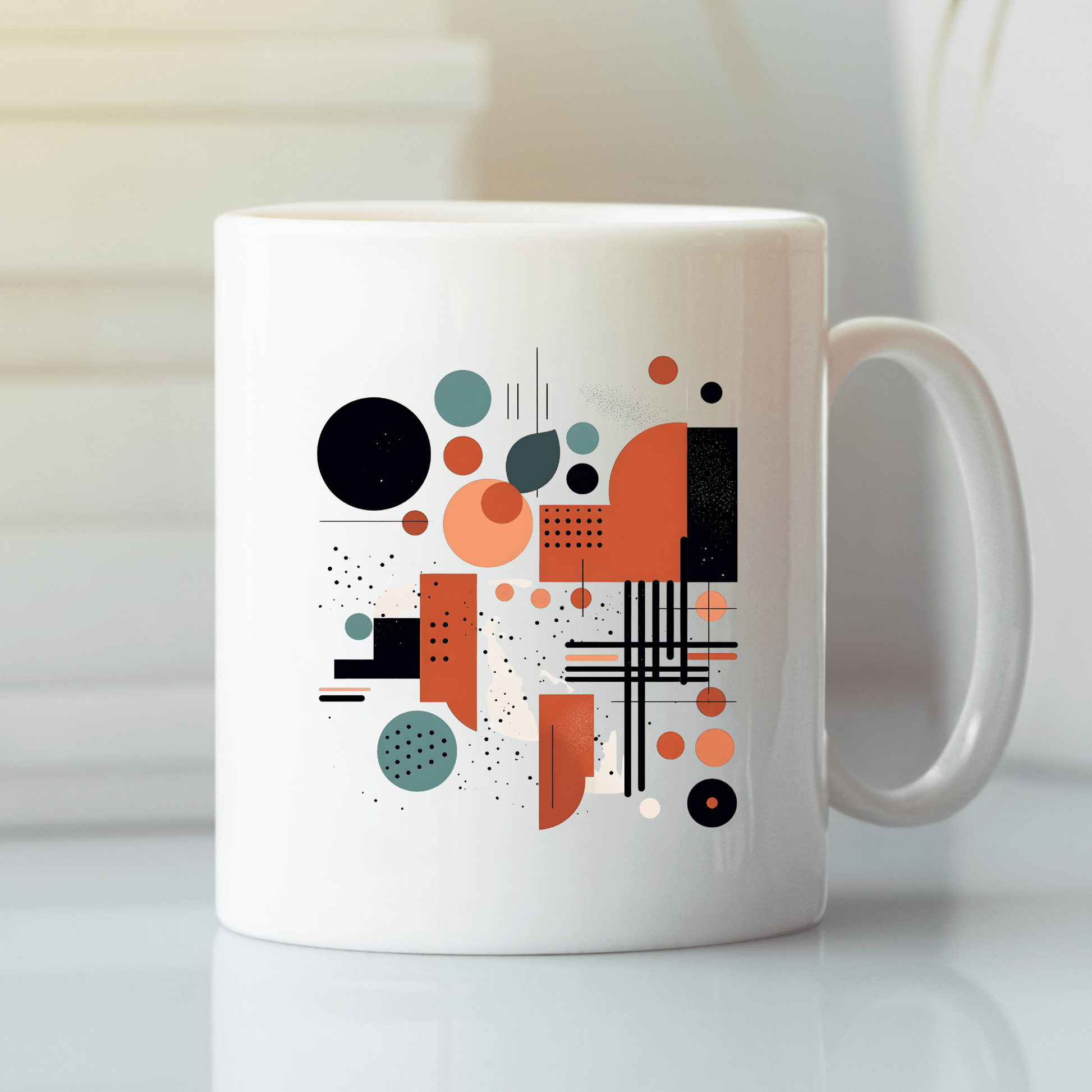 The Atomic Sunrise Mid Century Modern Mug is a white ceramic mug with a glossy finish, featuring an abstract geometric mid-century design in black, orange, and teal shapes—circles, rectangles, lines, and dots.