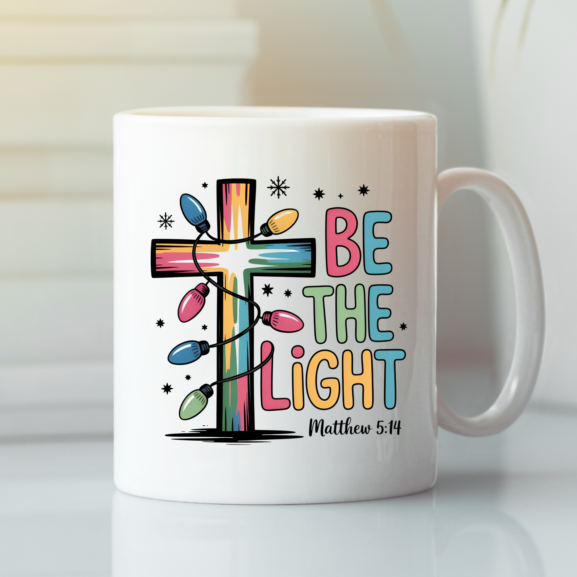 The Be the Light Matthew 5:14 Christmas Mug features a white mug with a vibrant cross wrapped in string lights, "BE THE LIGHT" in bold pastel letters, and "Matthew 5:14" beneath—an uplifting faith gift for the holiday season.