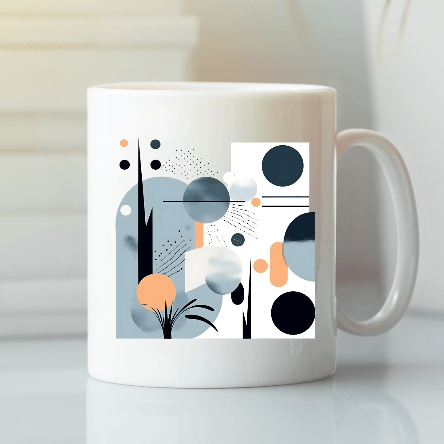 The Coastal Sunrise Mid Century Modern Mug features a white base with modern abstract blue, black, and peach geometric shapes—circles, rectangles, and lines—shown on a reflective surface.