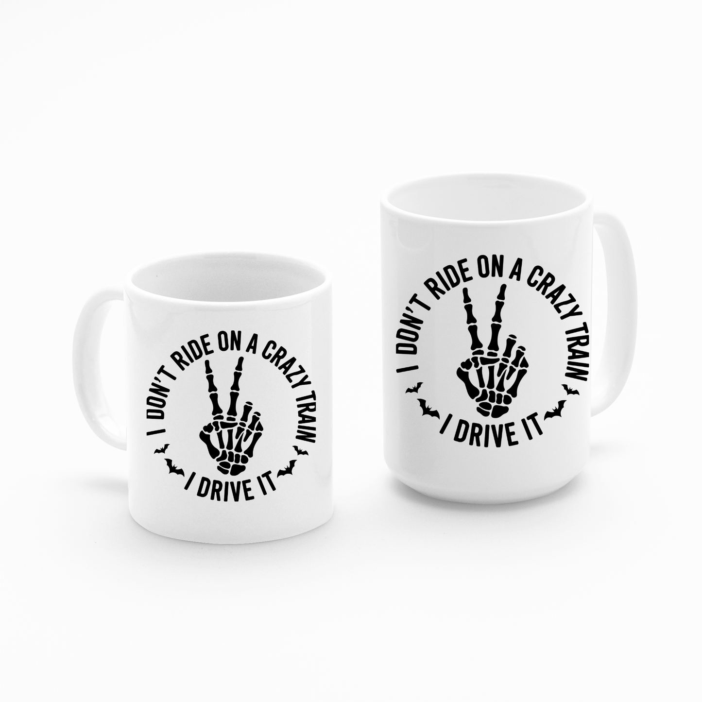 Sip in style with the Crazy Train Mug | Chaos Coffee Cup for Daily Mayhem! This set features two white mugs adorned with a black skeleton hand flashing a peace sign and the bold phrase, "I don't ride on a crazy train, I drive it," printed above and below the graphic. The perfect blend of dark humor and wit, these mugs let you flaunt your attitude while enjoying your daily dose of mayhem.