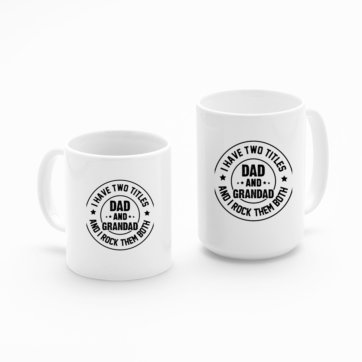 Set against a plain white background, the Dad and Grandad Mug | Gift for Proud Grandad features two white ceramic coffee mugs with the phrase “I have two titles Dad and Grandad and I rock them both” printed in bold black letters on the front. One mug is visibly smaller than the other, making this matching set a thoughtful Father’s Day gift for any proud grandad.
