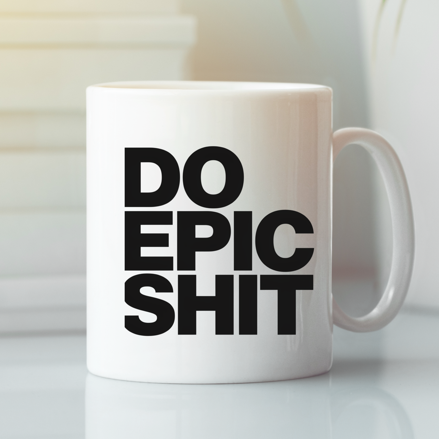 A Do Epic Shit Mug | Funny Motivational Coffee Mug, featuring bold black lettering spelling out "DO EPIC SHIT," rests on a white surface as soft light illuminates it from the left. This mug makes an ideal gift for entrepreneurs seeking a daily boost of humor and motivation.