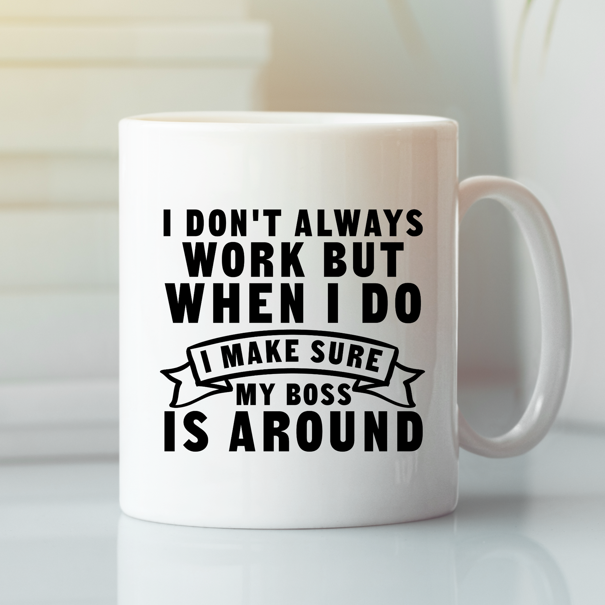 The Funny Work Mug | I Make Sure My Boss Is Around is a durable ceramic mug featuring the witty phrase: "I don't always work but when I do I make sure my boss is around" in bold black text—an ideal office gift.