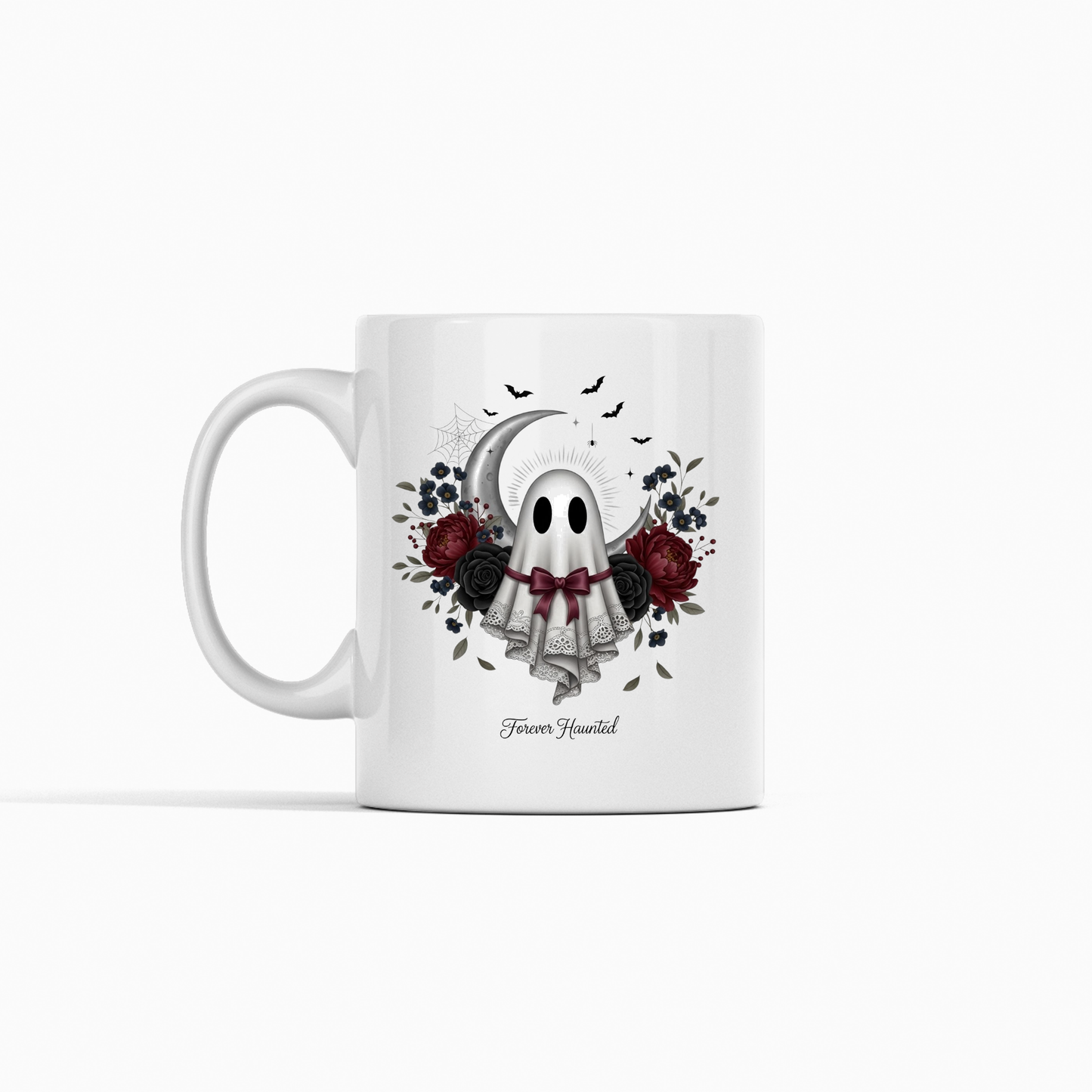 This Forever Haunted Ghost Mug | Gothic Halloween Coffee Mug showcases a charming ghost adorned with a veil and bow, surrounded by dark roses, leaves, spider webs, and fluttering bats. With "Forever Haunted" elegantly inscribed beneath the mesmerizing artwork, this mug is perfect for celebrating the spooky season.