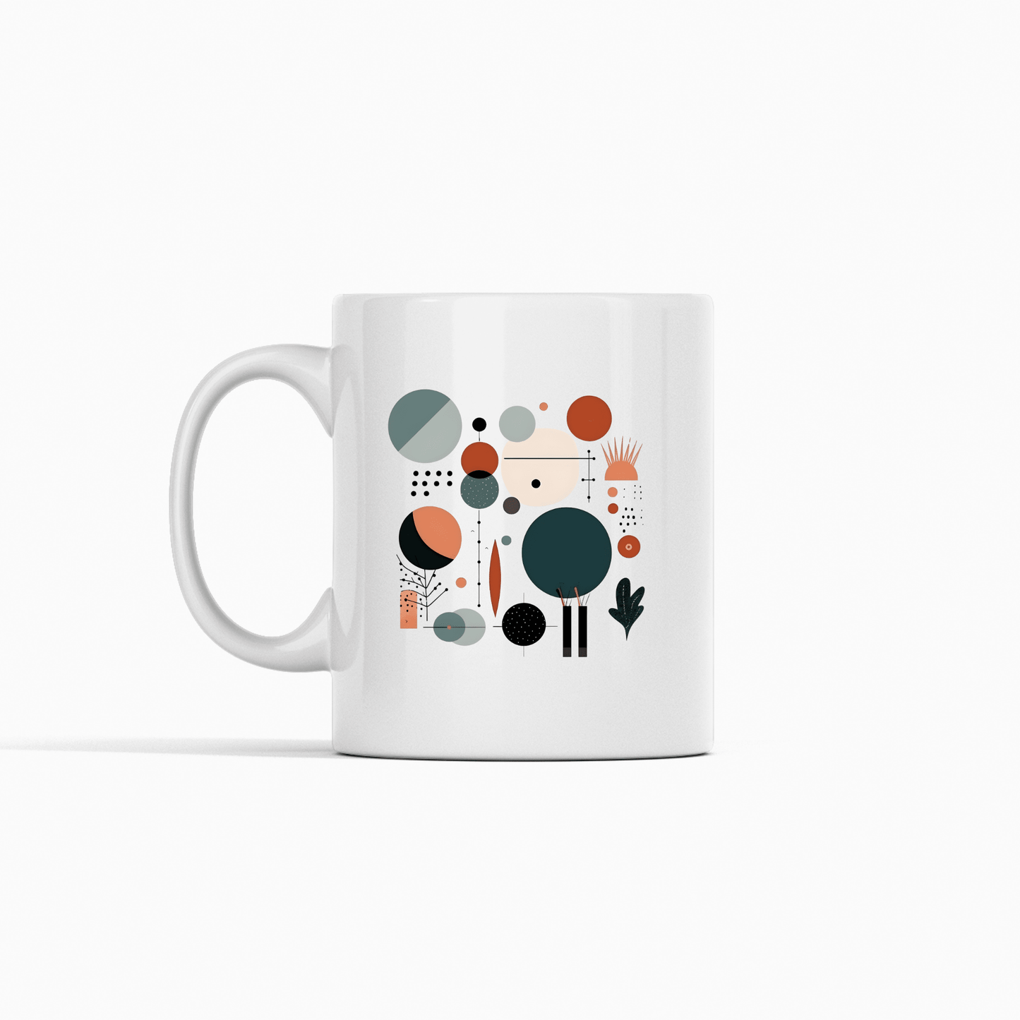 The Harvest Sun Mid Century Modern Mug is a white ceramic mug with an abstract geometric pattern of circles, dots, and lines in orange, teal, gray, and black on a plain white background.