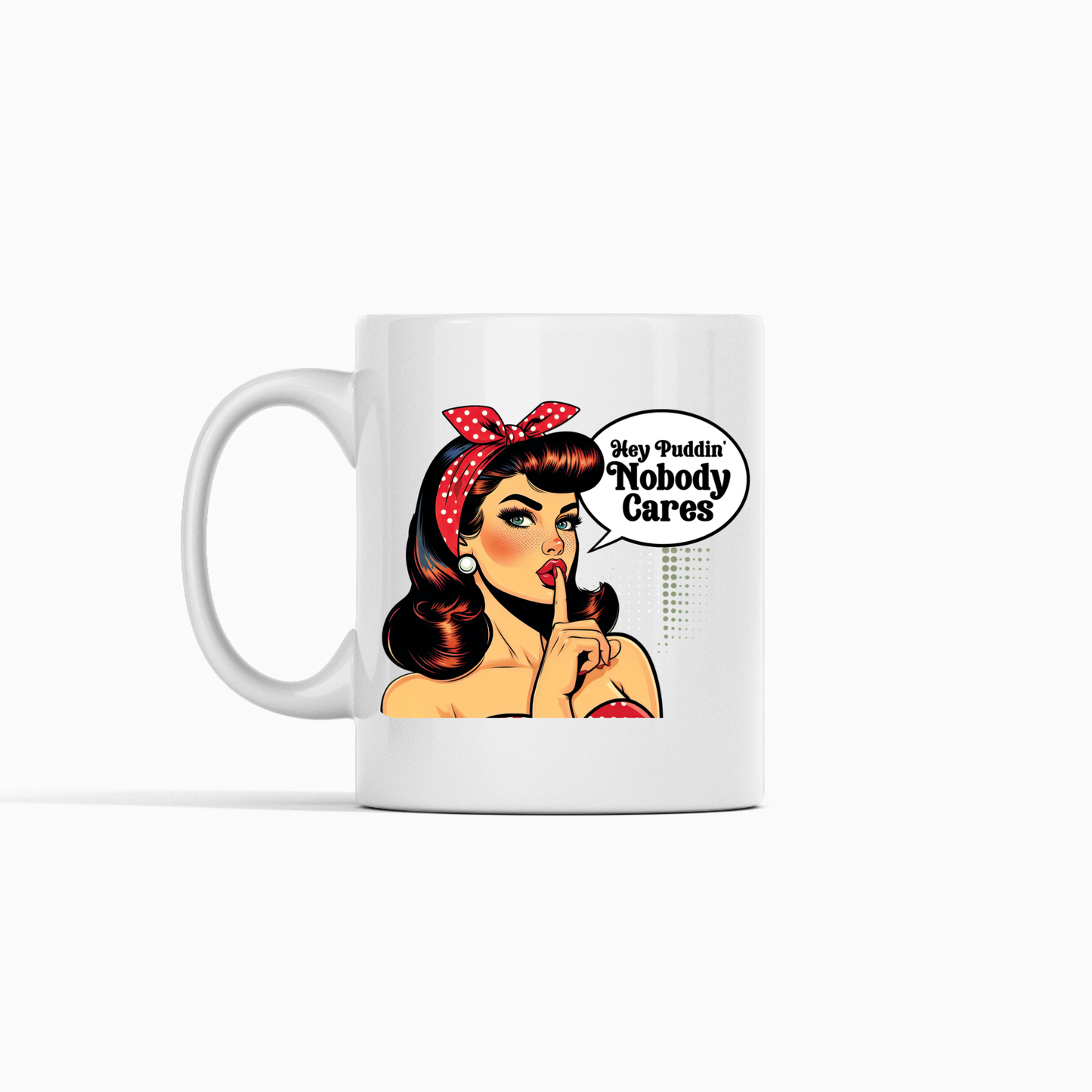 The Hey Puddin’ Nobody Cares Mug is a retro pop art coffee mug featuring a vintage cartoon woman with red lipstick and a polka-dot headband, plus the quote "Hey Puddin, Nobody Cares." A funny, sarcastic gift for any occasion.