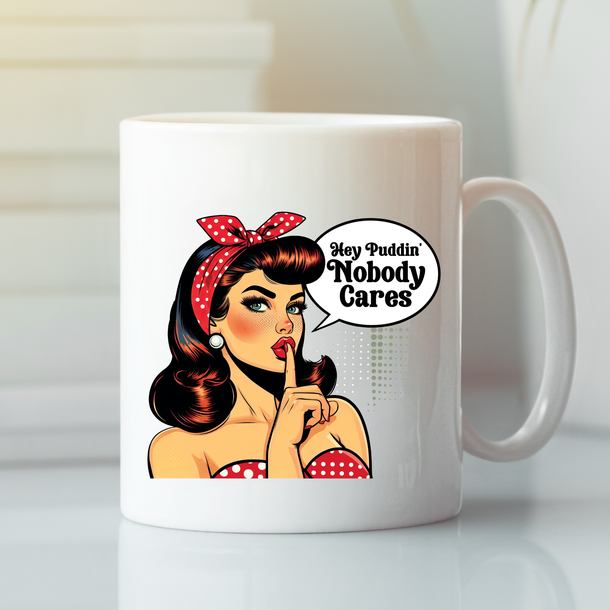 The Hey Puddin’ Nobody Cares Mug is a retro pop art mug showing a vintage woman in red polka dots with a “Hey Puddin’ Nobody Cares” speech bubble—perfect as a funny, sarcastic gift or coffee mug.