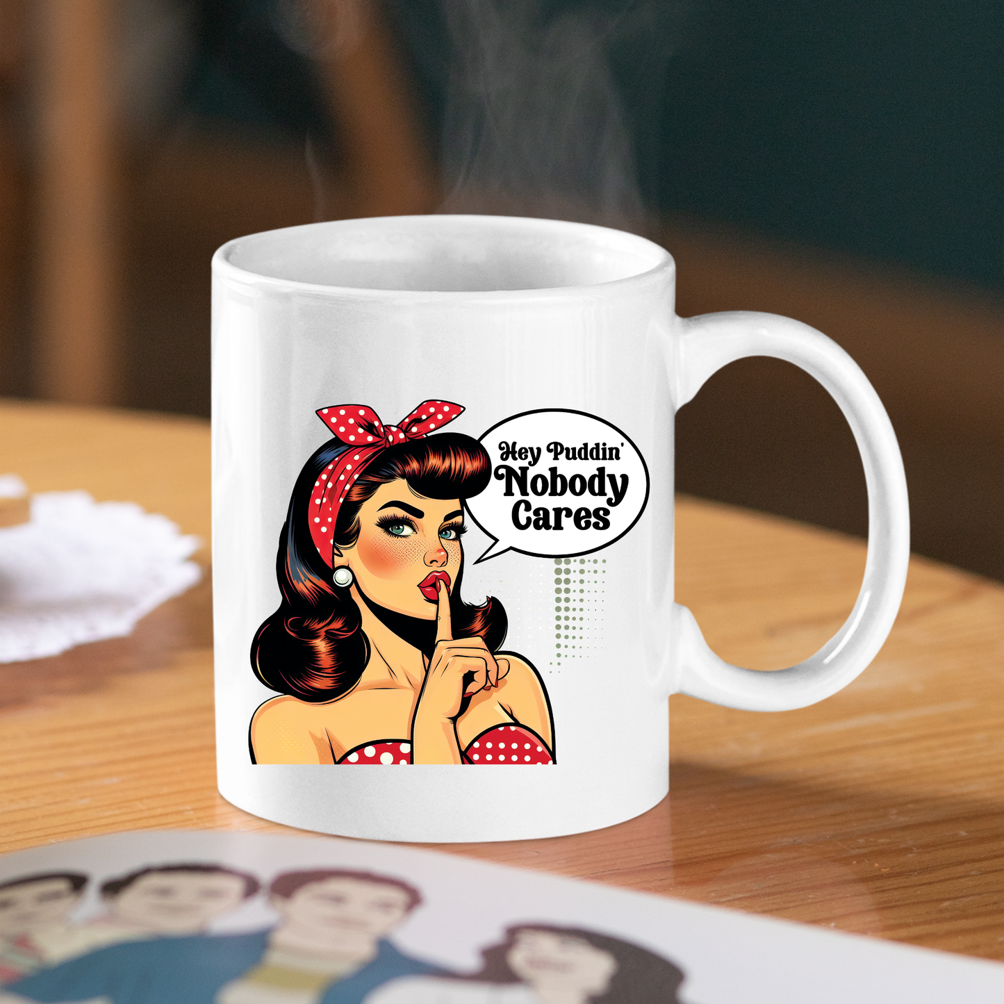 The Hey Puddin’ Nobody Cares Mug features a retro pop art cartoon woman with a “Hey Puddin' Nobody Cares” speech bubble—perfect as a funny, sarcastic gift for coffee lovers.