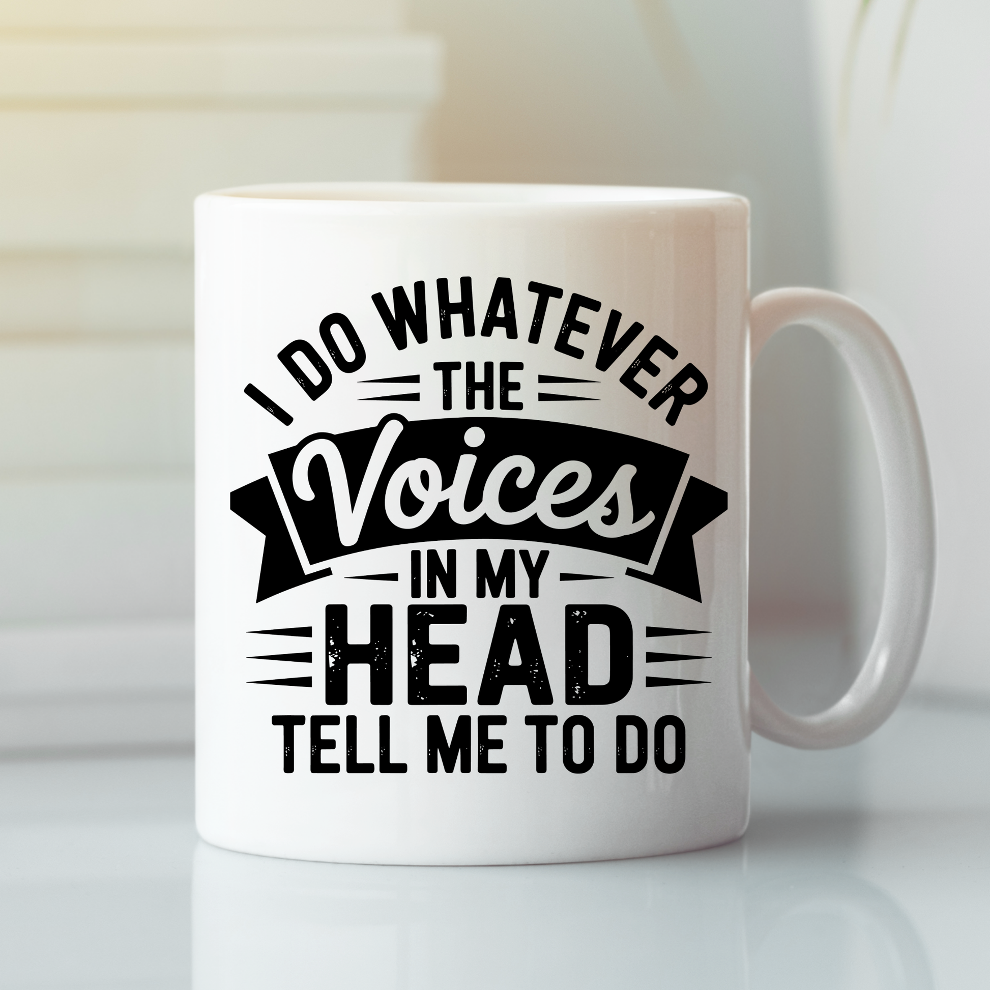 The Voices in My Head Mug | Sarcastic Coffee Gift is a white coffee mug featuring the phrase "I do whatever the voices in my head tell me to do" printed in bold black letters, making it an ideal humorous gift for anyone who enjoys a touch of sarcasm with their daily coffee.