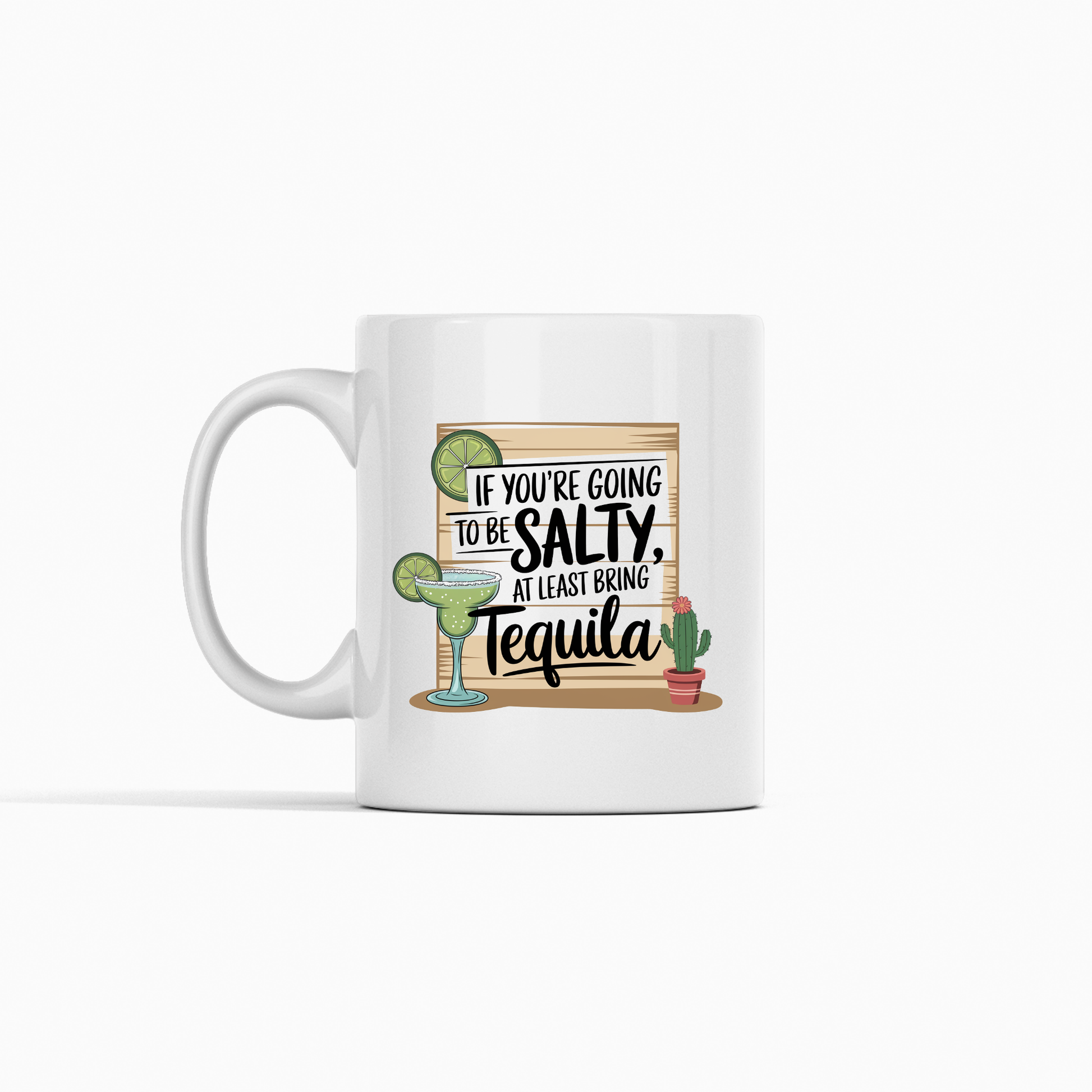 The If You're Going to Be Salty Bring Tequila Mug features a playful design with a margarita, a small cactus, and a sign that says, “If you’re going to be salty, at least bring tequila.” With its plain white background, this mug makes a funny coffee mug or a unique tequila-themed gift for any margarita lover.