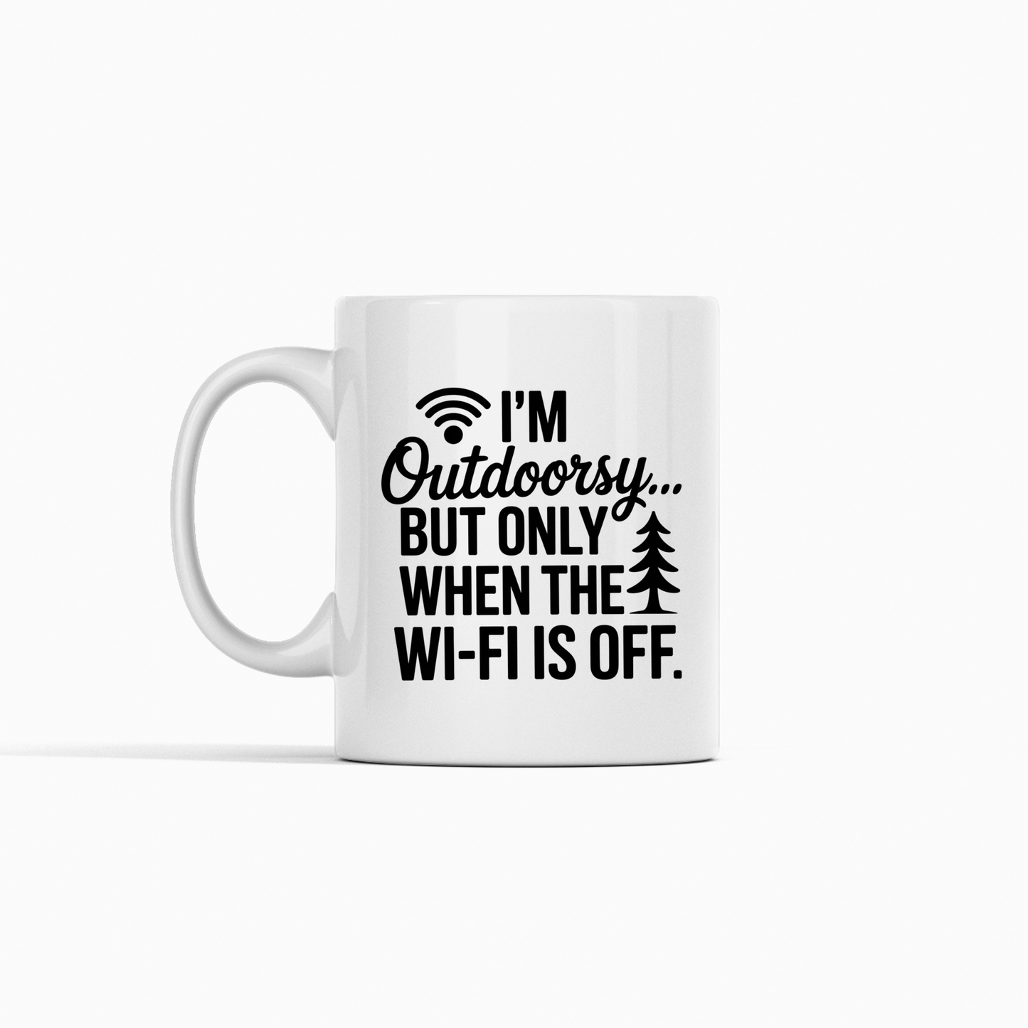 Introducing the "I'm Outdoorsy... But Only When the Wi-Fi Is Off Mug"—a white camping mug featuring bold black text, a playful Wi-Fi symbol, and a small tree graphic. This humorous coffee mug is an ideal gift for nature lovers who appreciate a good laugh.