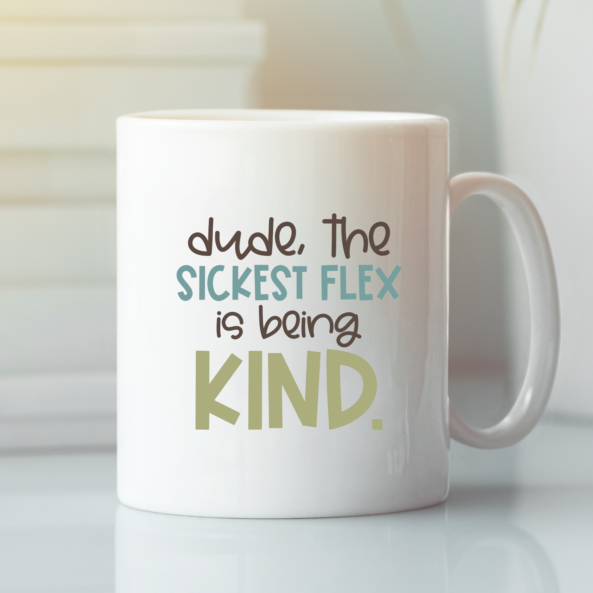 The Kindness Classroom Mug | Positive Culture Gift features “dude, the SICKEST FLEX is being KIND.” in playful pastels—perfect for teacher appreciation or inspiring classroom culture. Displayed on a light, reflective surface with soft lighting.