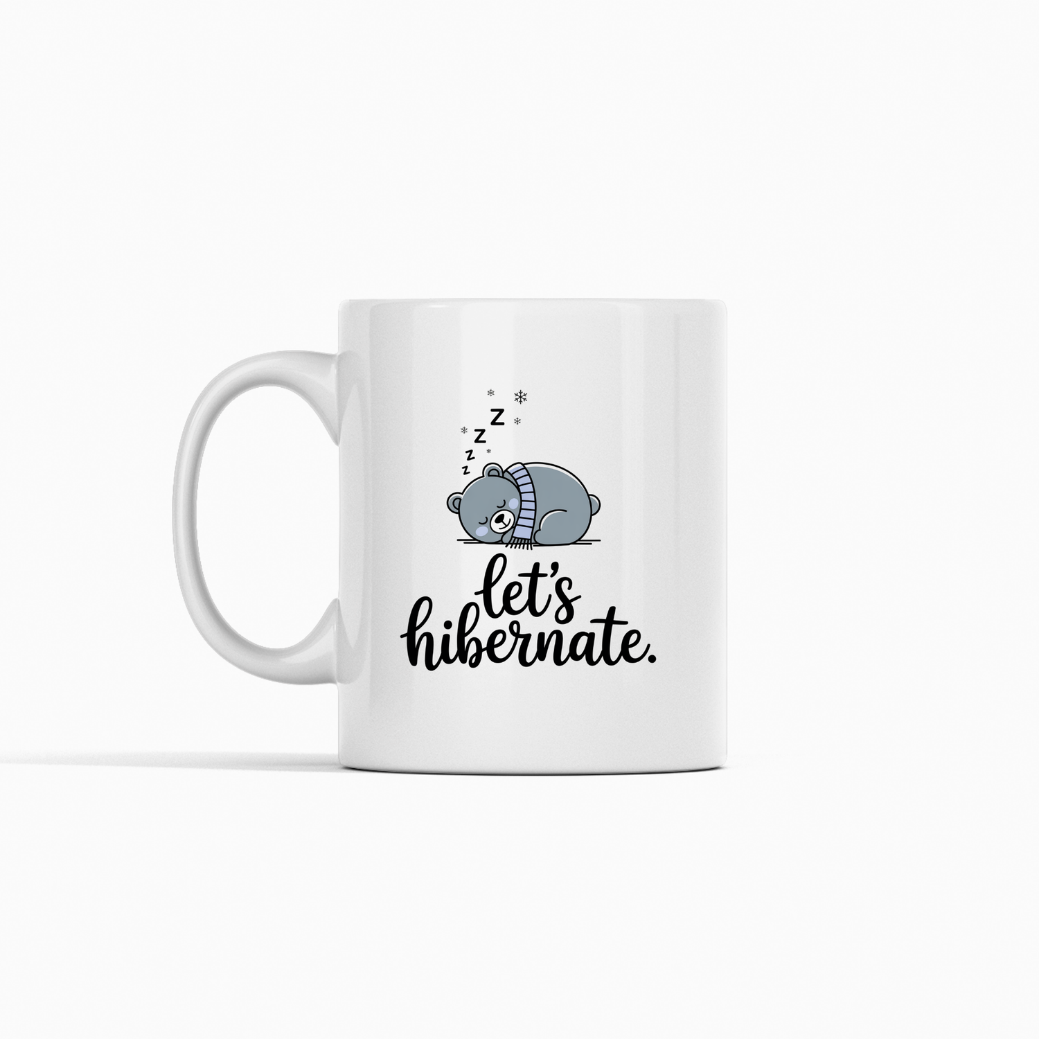 The Let’s Hibernate Mug | Cozy Winter Gift for Homebodies features a ceramic design with a sleeping bear in a blue hat, “Z”s, stars, and playful “let’s hibernate” text—ideal for cozy winter coffee moments.