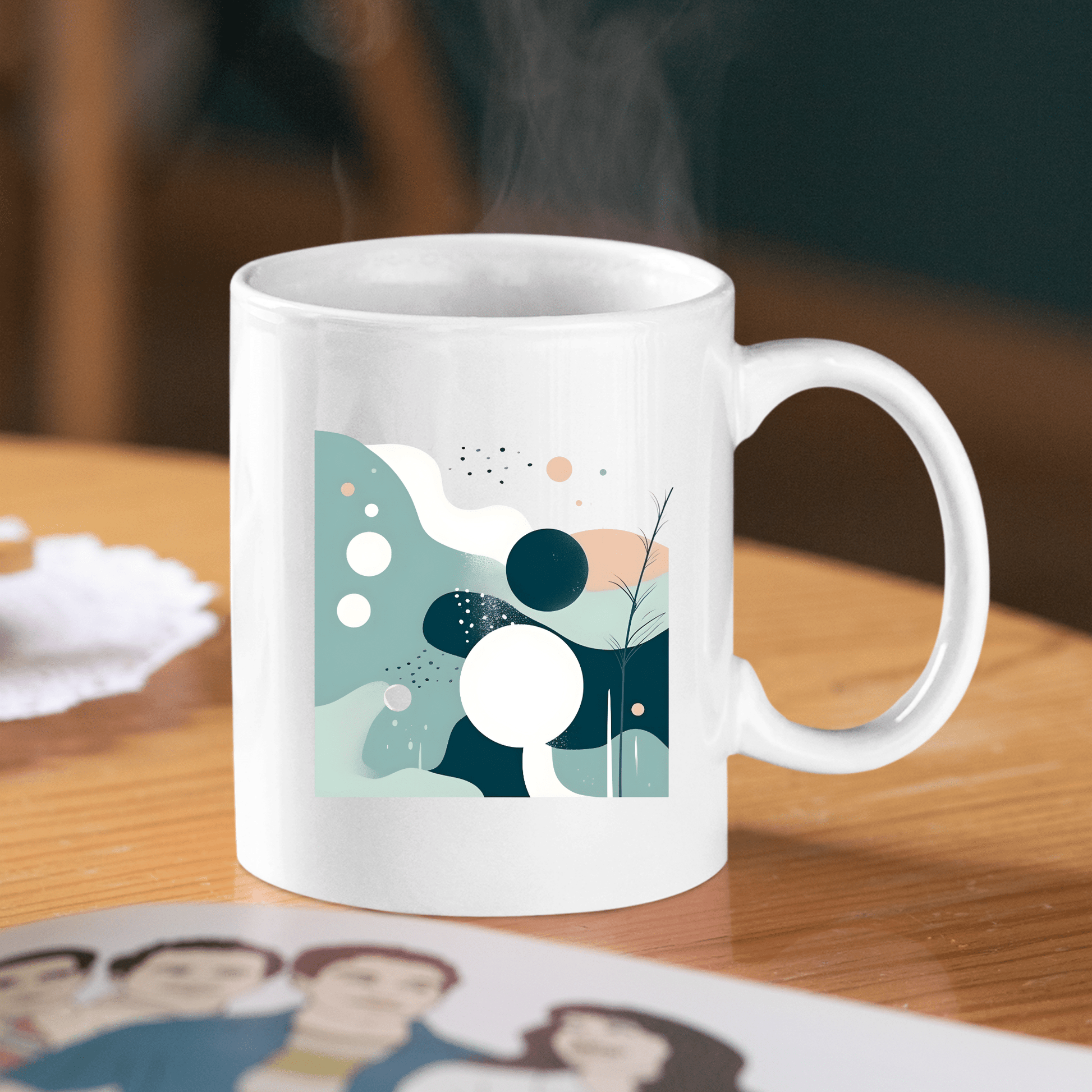 The Quiet Tides Mid Century Modern Mug, featuring a striking abstract design in teal, white, and black, sits on a wooden table as steam rises from the ceramic, suggesting a hot beverage inside.