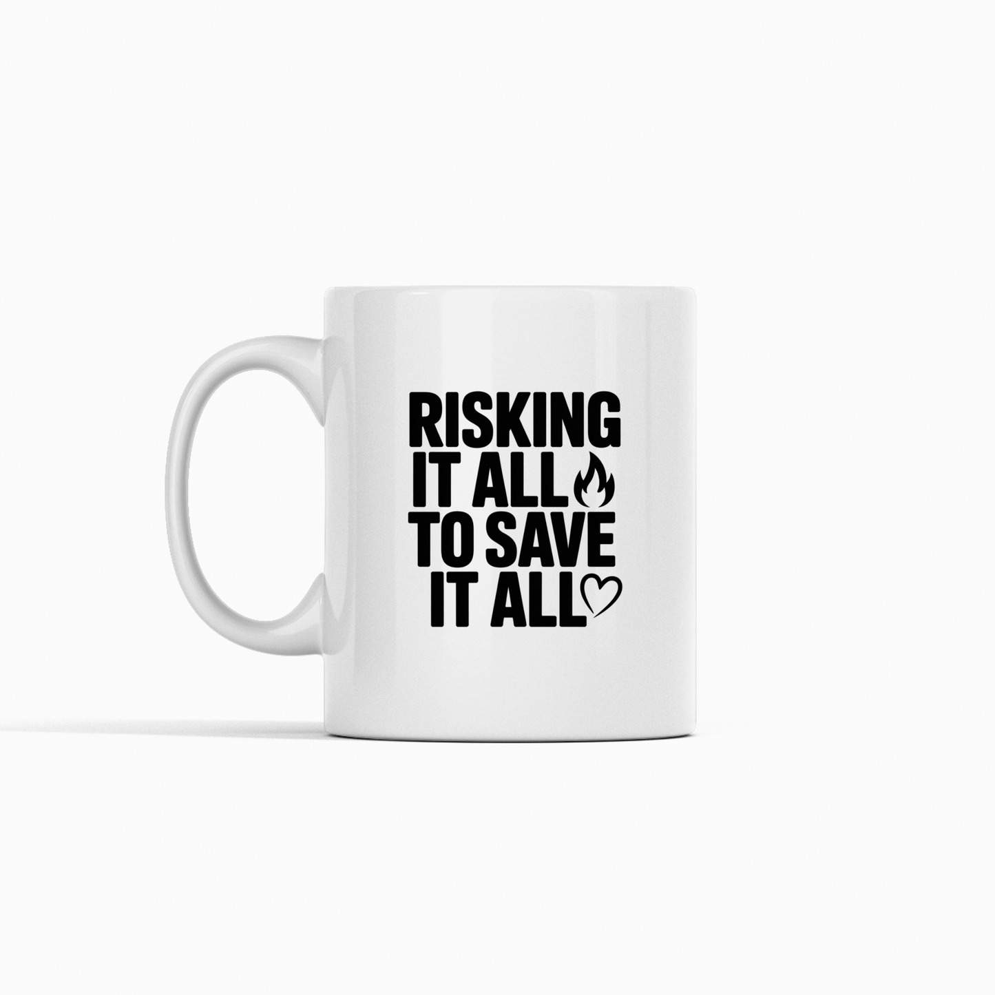The Risking It All to Save It All Firefighter Mug is a white mug featuring the phrase "RISKING IT ALL TO SAVE IT ALL" in bold black letters, accented with a small flame icon on the word "ALL" and a heart outline beside the last "ALL." An ideal gift to show appreciation for firefighters.