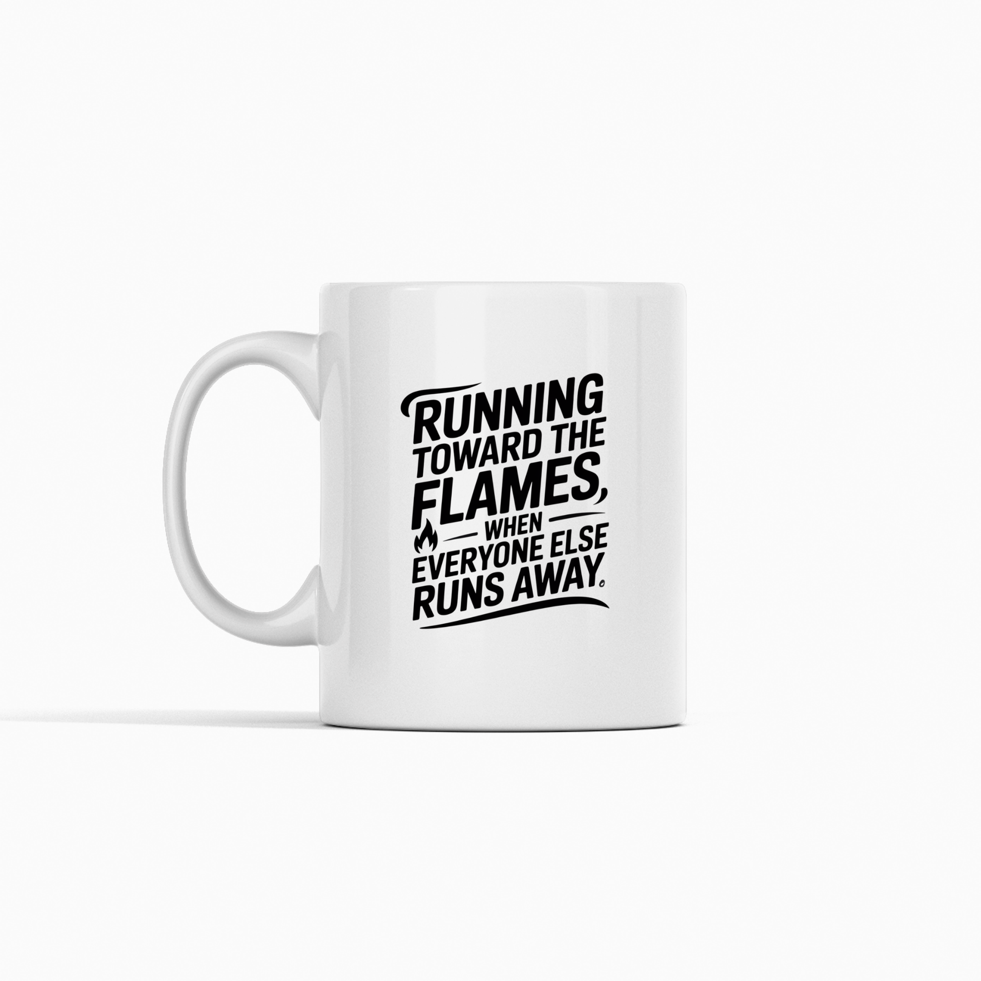 Introducing the Running Toward the Flames Firefighter Mug—a white mug featuring bold black text that reads, "Running toward the flames, when everyone else runs away," with a small flame graphic on the left. This stylized design makes it an ideal firefighter gift or courage coffee mug to honor bravery.