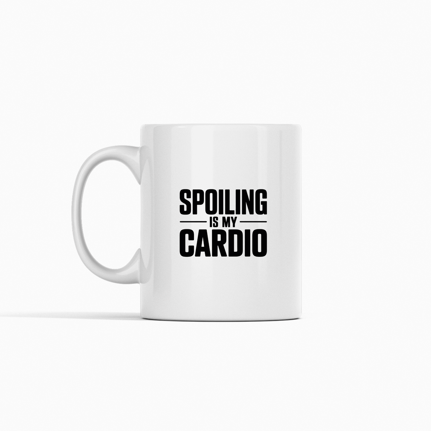 The Spoiling Is My Cardio Mug | Funny Grandparent Gift features a white ceramic design with the phrase "SPOILING IS MY CARDIO" printed in bold black letters on the front. Perfect for any collection, this grandparent mug is an ideal gift choice for grandparents who take pride in spoiling their loved ones.