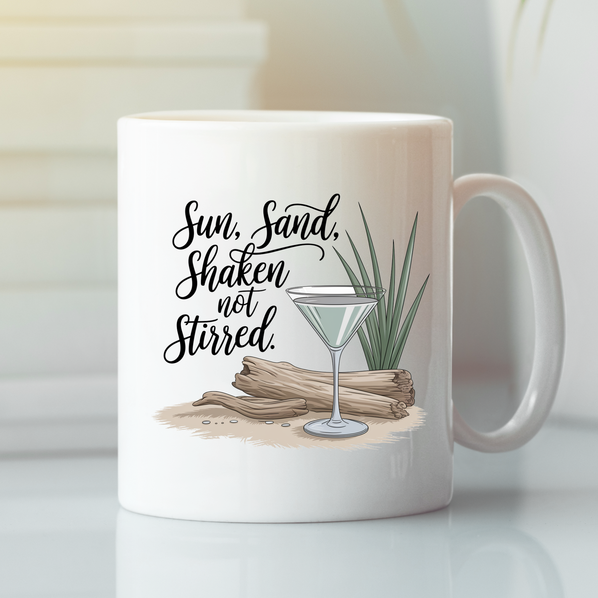 Introducing the Sun Sand Shaken Not Stirred Mug | Beach Lover Gift—a white mug featuring an illustration of driftwood, sand, grass, and a martini glass. The design is accented with the phrase "Sun, Sand, Shaken not Stirred," while soft lighting and a blurred background enhance its tropical beach vibes. This mug makes an ideal gift for any beach lover.