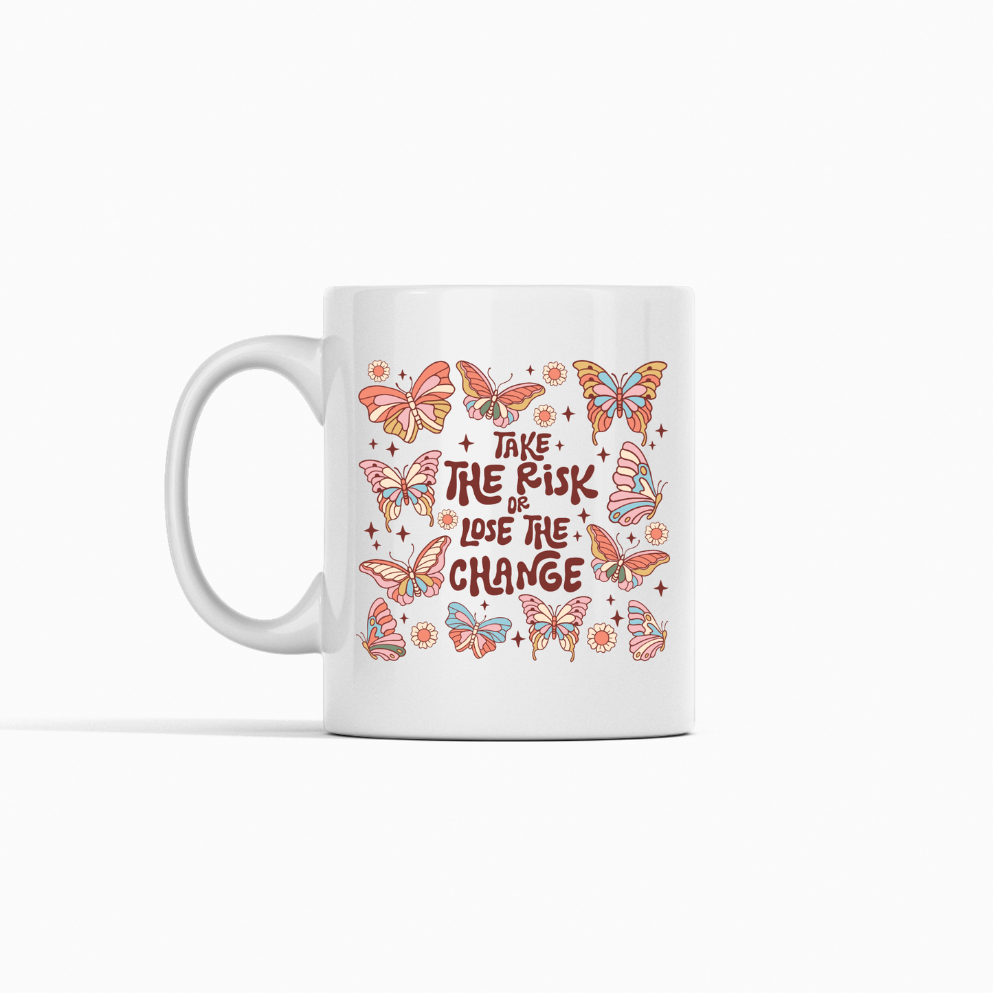 The Take the Risk or Lose the Chance Mug | Inspirational Coffee Mug features a white ceramic design adorned with vibrant orange and pink butterflies around the motivational phrase "Take the risk or lose the chance" in bold, decorative lettering—making it a perfect gift to inspire and motivate.